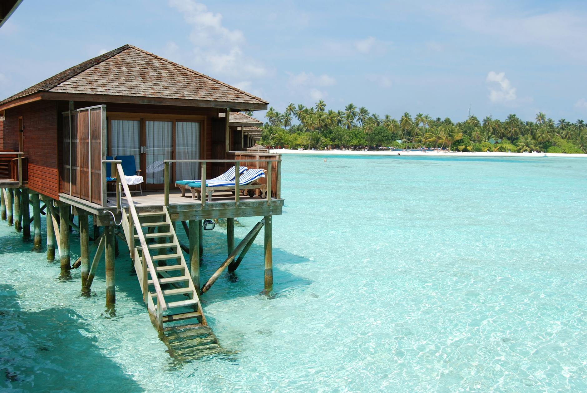 brown wooden house on beach